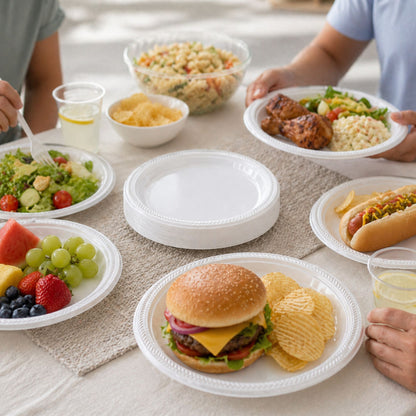 People enjoying a meal with various food items on a table.