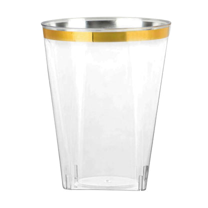 Clear plastic cup with gold rim on a white background