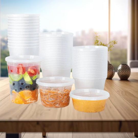 Stacks of plastic containers with food on a wooden table