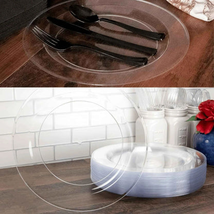 Clear plastic plates with cutlery on a wooden surface, followed by a stack of clear plastic plates.