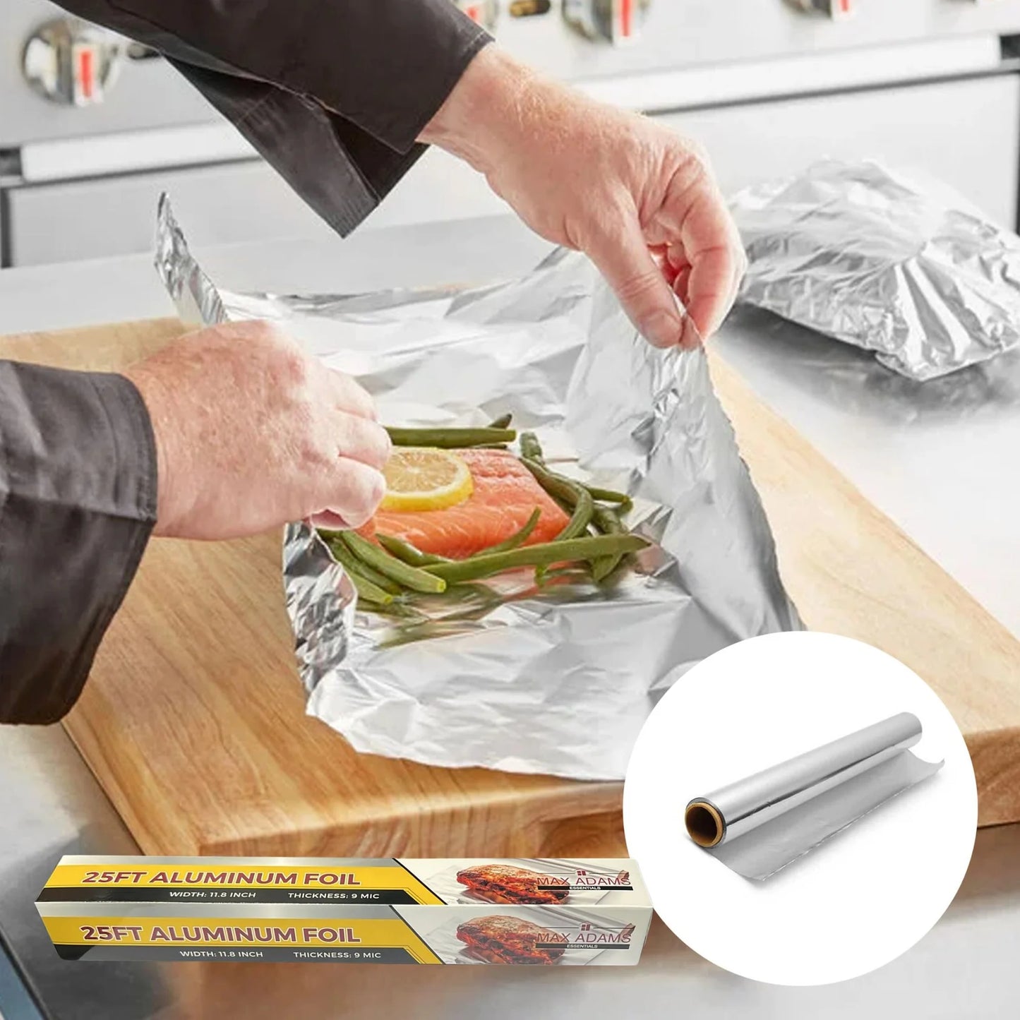 Person preparing a foil packet with salmon and vegetables on a kitchen counter, with a roll of aluminum foil inset.